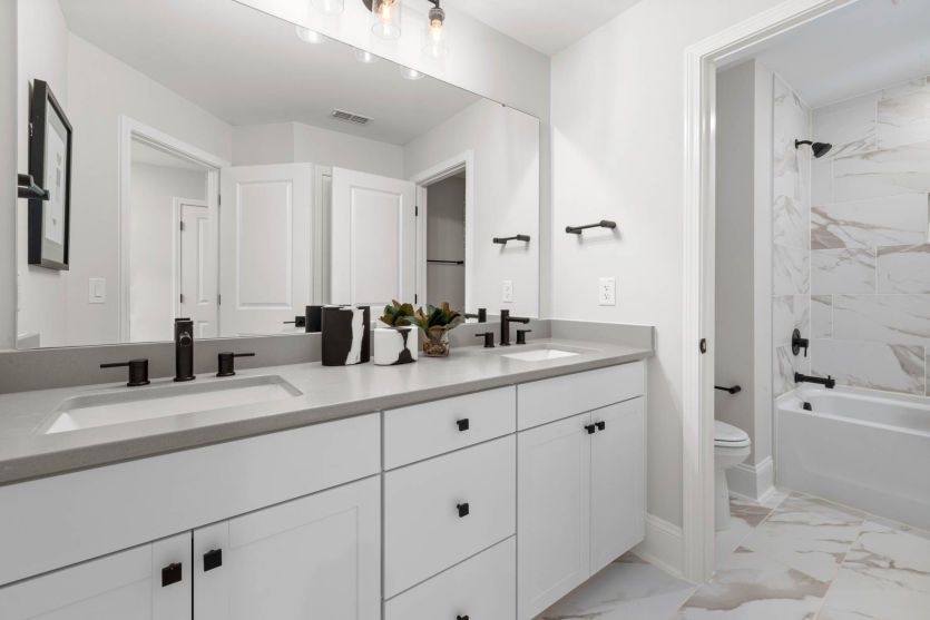 Spacious Secondary Bath with Sinks Separate from Shower - Model Representation