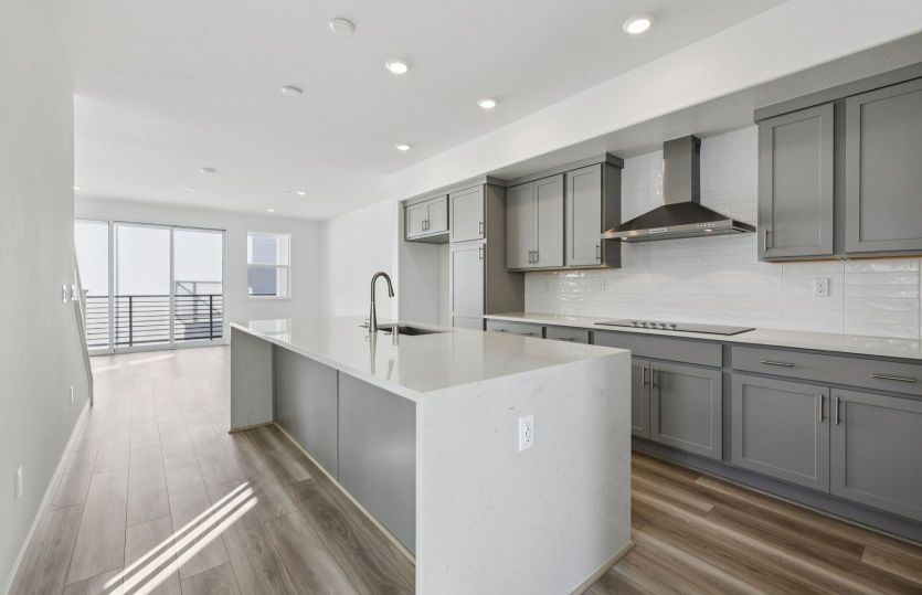 Kitchen with large waterfall edge island