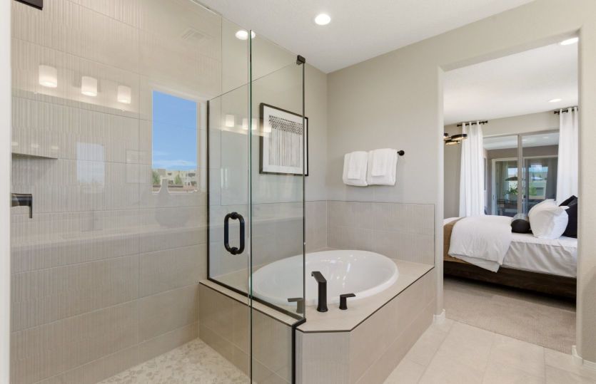 Unwind from the day in your dreamy tile bathtub in the owner's suite bath.