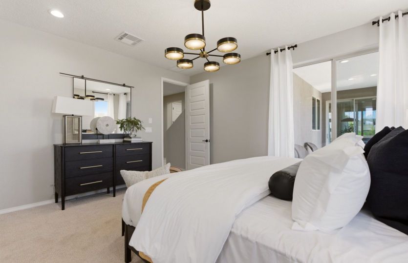 A bright window in the owner's suite can be replaced with a sliding glass door for access to the cov