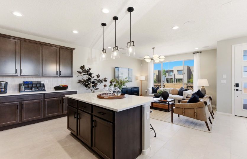 Over the island is the option to add a drop-down accent ceiling and pendant lights for an impressive
