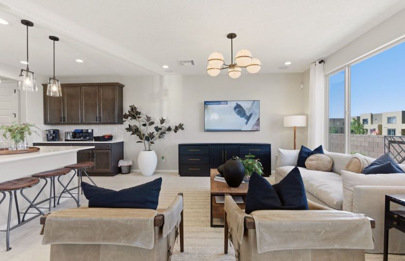 Gathering room offers space for ample seating, a bright window and overhead lighting.