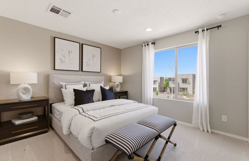 Bedroom 2 on the second floor with spacious closet and views out the bright window.