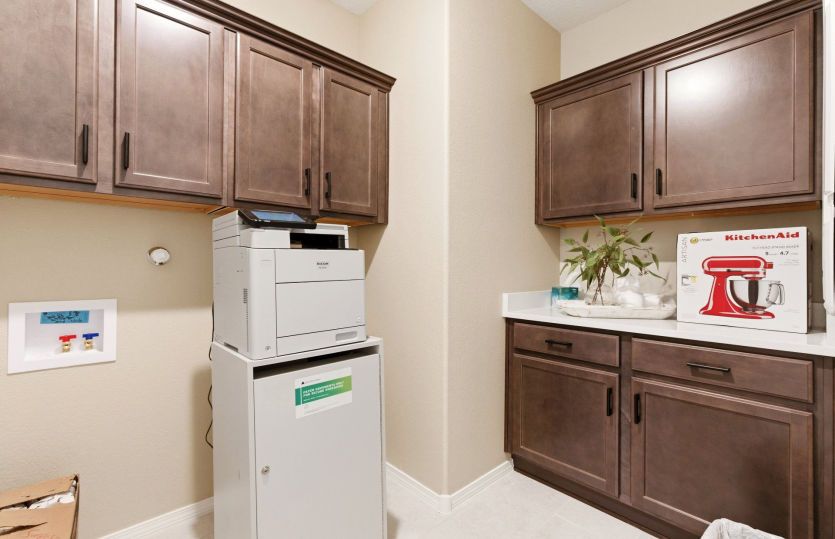 Laundry room with washer and dryer plus a storage shelf or optional cabinets.