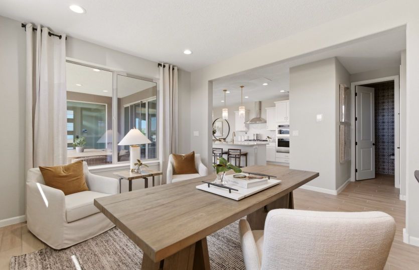The den just off the kitchen allows for a home office and can be enhanced with tray ceiling and deco