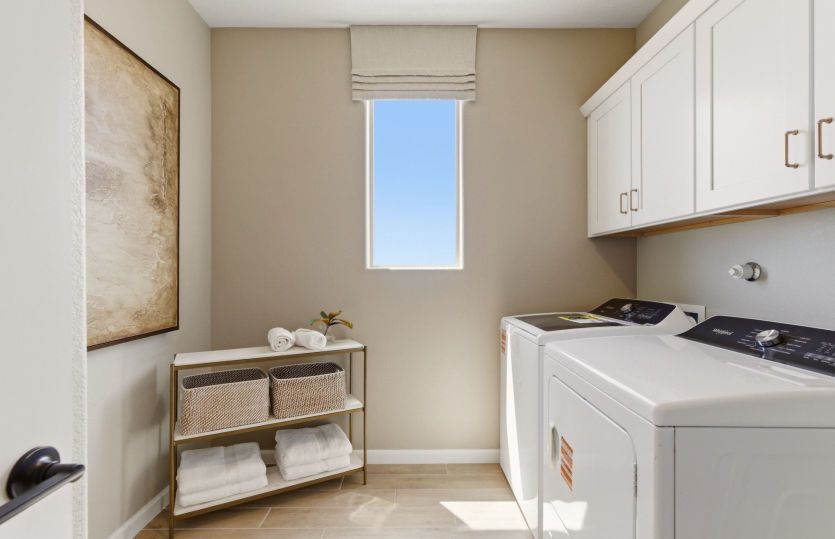 Laundry room offers functionality as well as space and lighting to make chores just a little more en