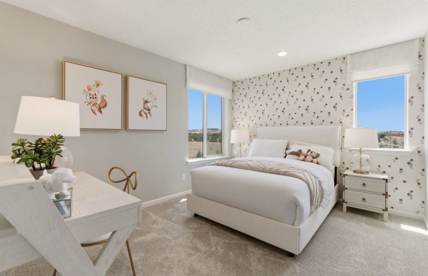 Spacious secondary bedroom with bright window is suitable for overnight guests or family members.