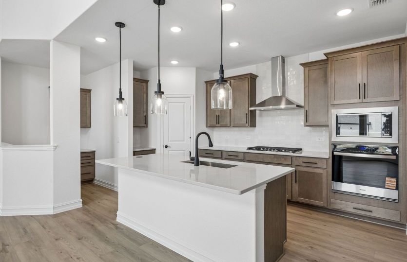 Beautiful kitchen with pendent lighting