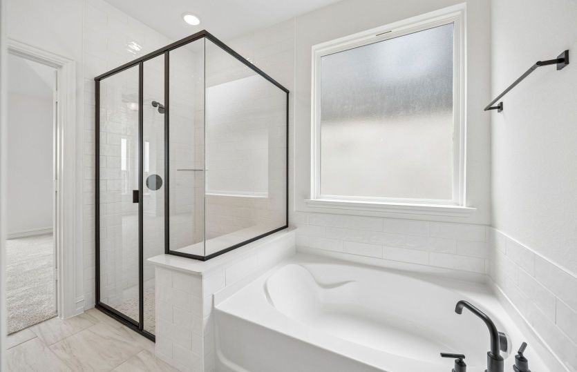 Owners bath with separate tub and shower