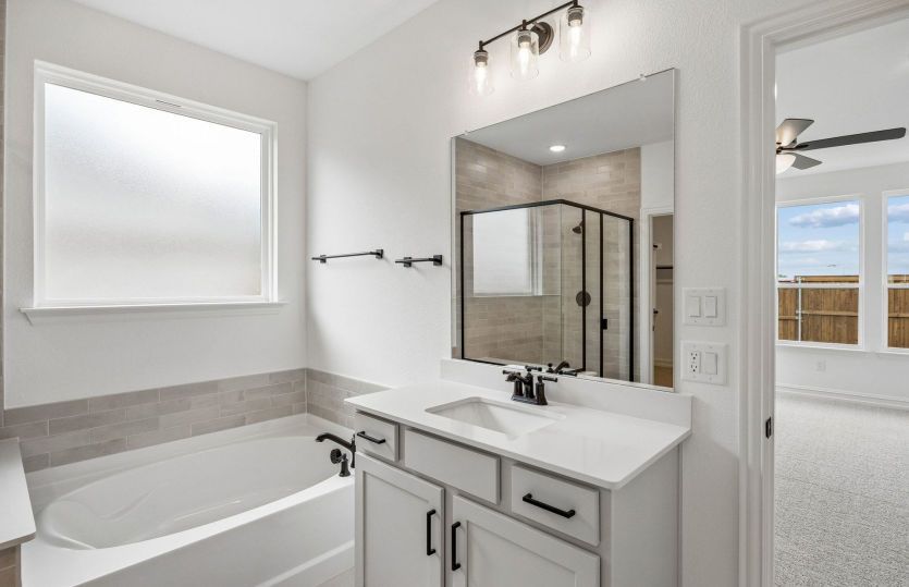 Owners bath with separate tub and shower