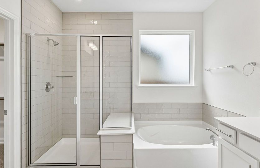 Owners bath with separate tub and shower