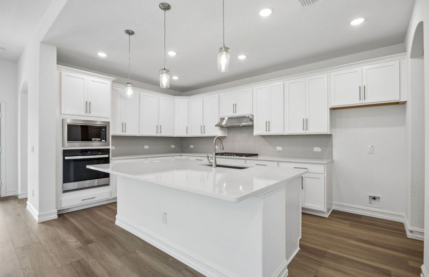 Kitchen with eat in bartop island