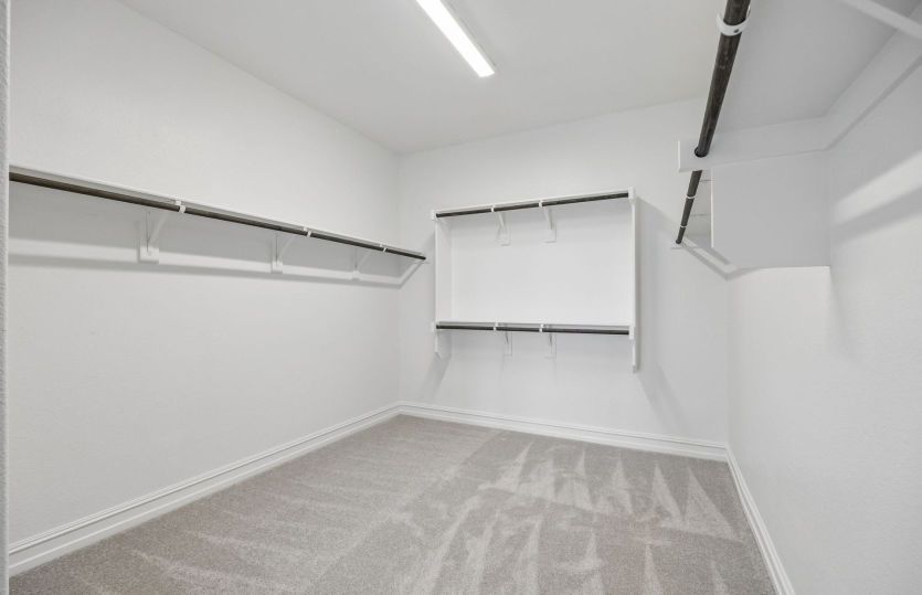 Spacious walk-in closet in primary suite
