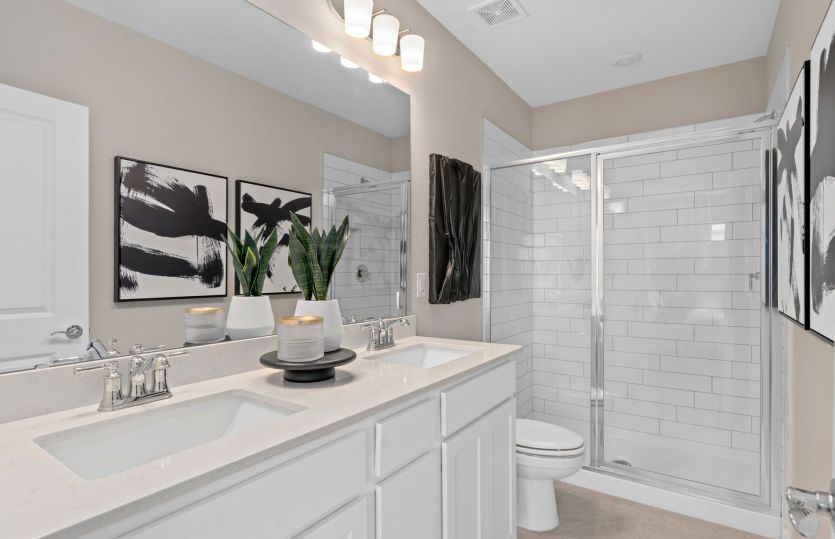 Owner's bathroom with dual sink vanity