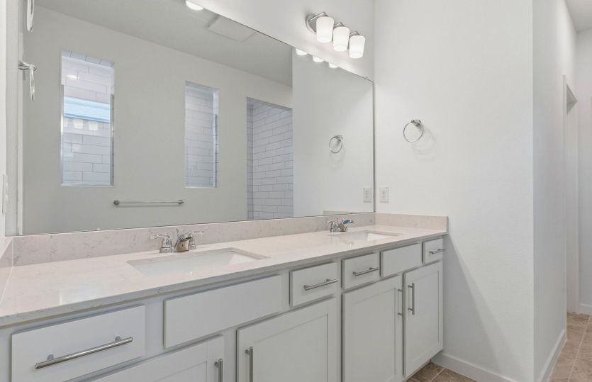 Owner's bathroom with dual sink vanity