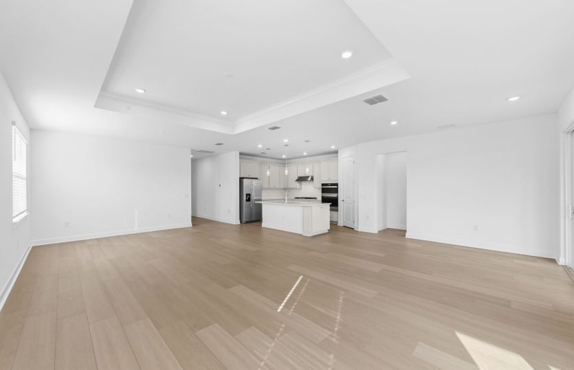Spacious gathering room featuring a drop tray ceiling