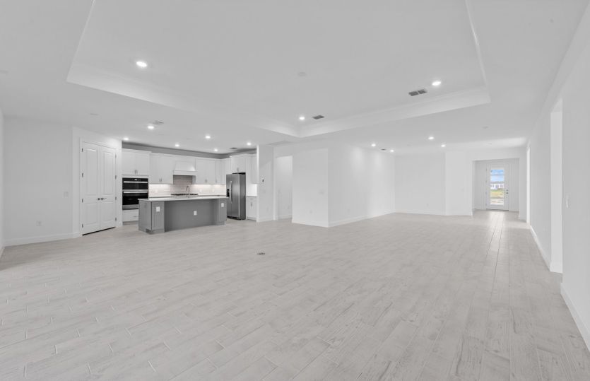 Spacious gathering room featuring a drop tray ceiling