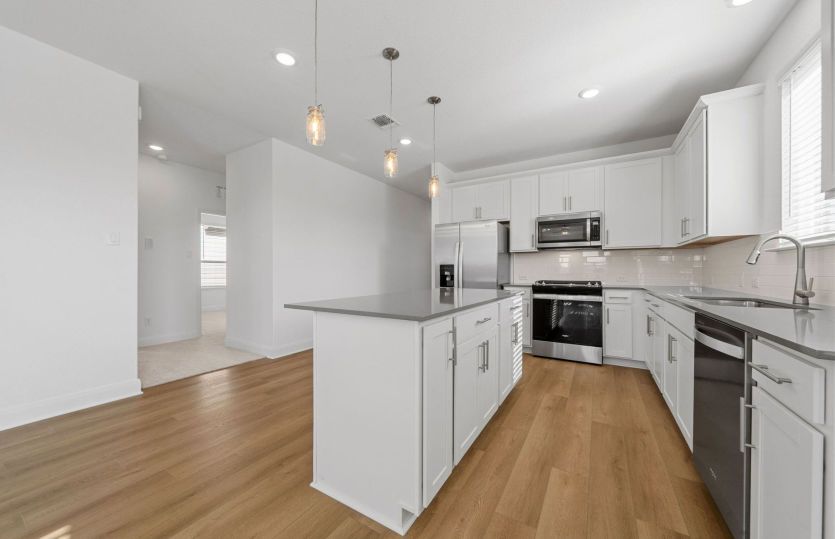 Representational Photo- Kitchen Open to the Gathering Space