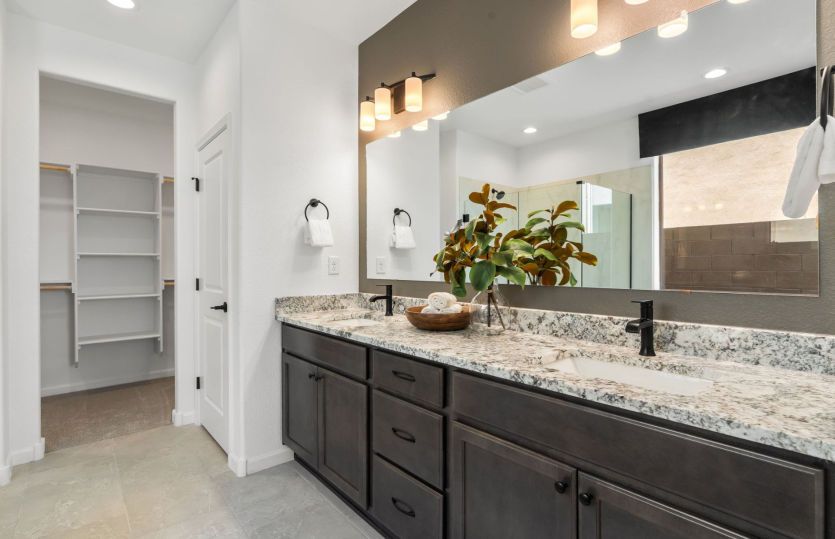 Owner's bath with dual sinks and ample storage
