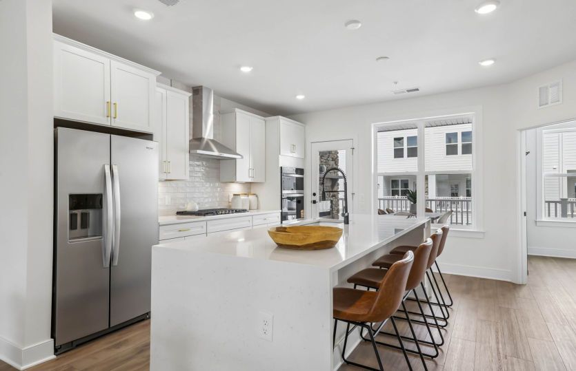Gourmet Kitchen with Cascade Island - Actual Home