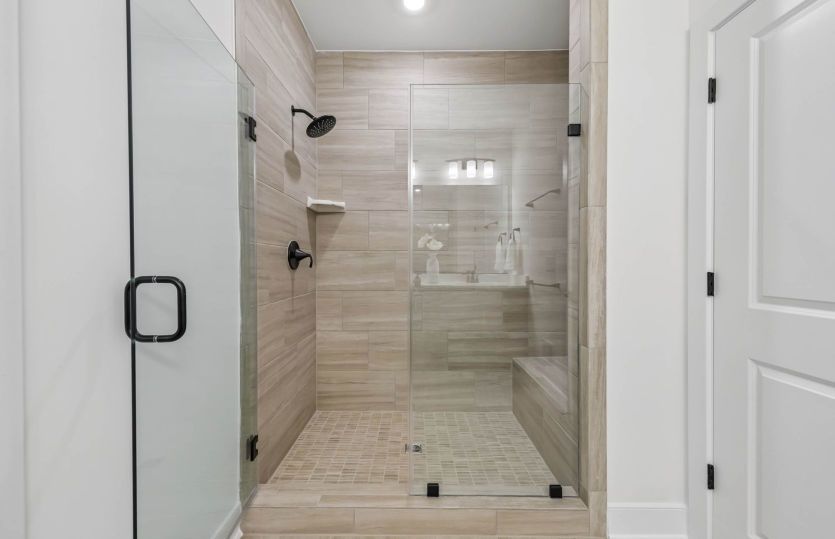 Luxurious Owner's Bath with Frameless Glass Shower - Actual Home