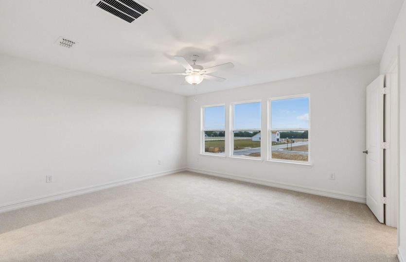 Spacious primary suite with large windows