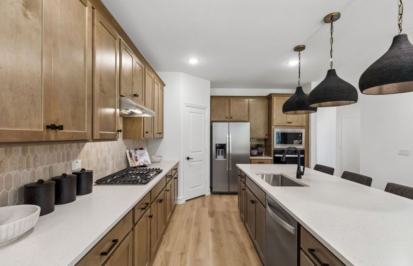 Spacious kitchen with abundant cabinet space *model representation