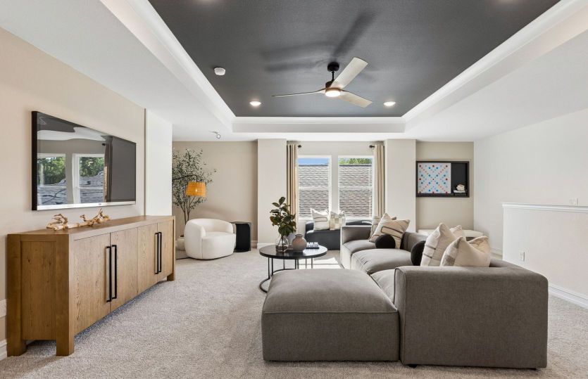 Spacious game room with large windows *model representation