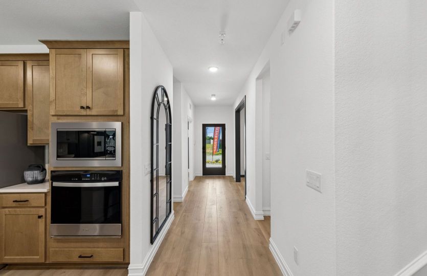 Welcoming entryway with flexible living space *model representation