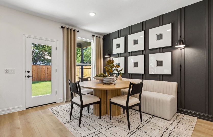 Dining nook off kitchen with access to backyard