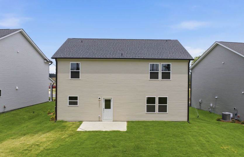 Aspire - #010 - Back View shows Large Yard & Outdoor Patio for Barbeques