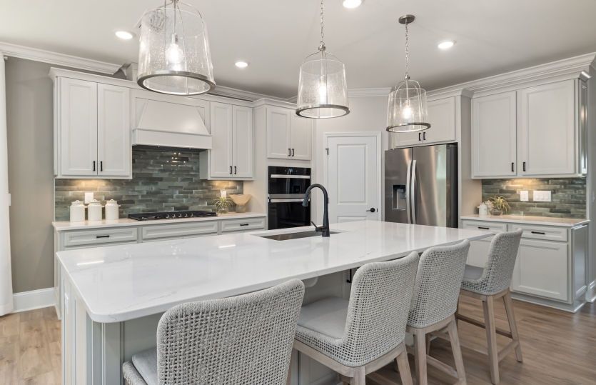 Stylish Kitchen with Ample Storage & Extra Seating - Model Representation