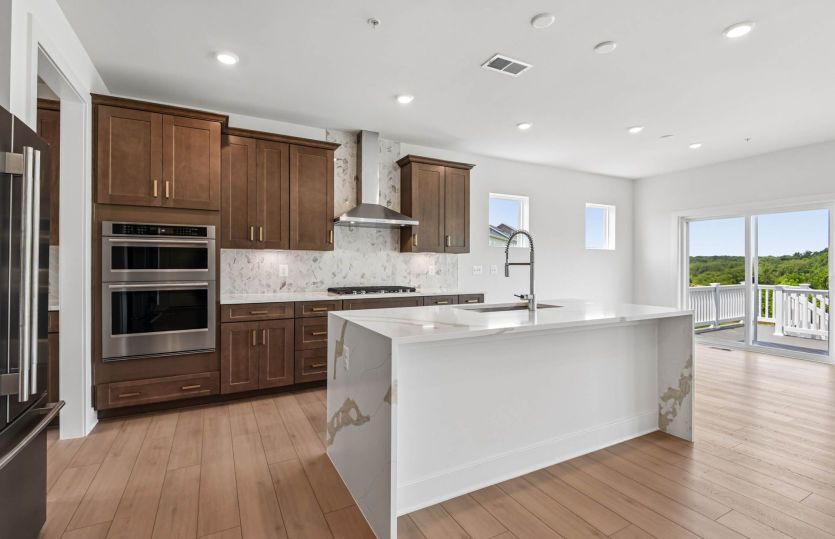 Gourmet Kitchen with Cascade Island - Actual Home