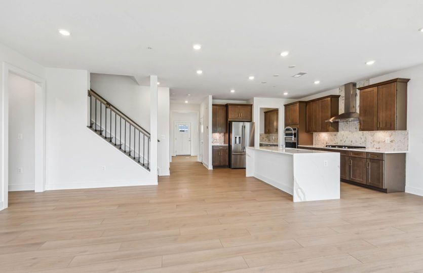 Gourmet Kitchen Opens to Gathering Room and Café - Actual Home