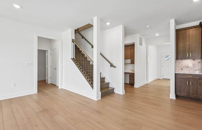Welcoming Foyer Opens to the Gourmet Kitchen and Gathering Room - Actual Home