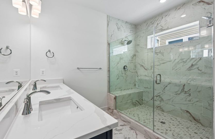 Luxurious Owner's Suite with Frameless Glass Shower and Seat - Actual Home