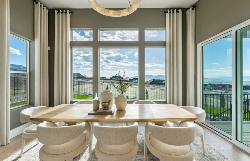 Well-lit dining space with outdoor views