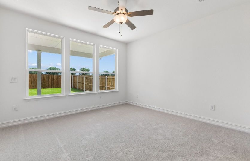 Primary suite with large windows *model representation
