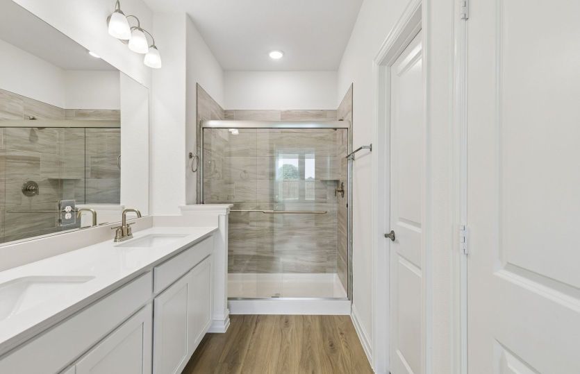 Primary bath with beautiful glass shower *model representation