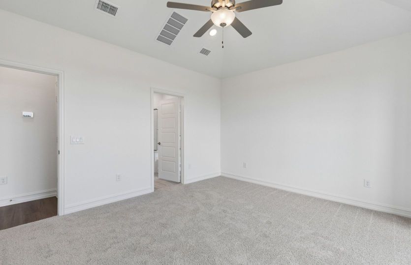 Primary suite with private bath and walk-in closet