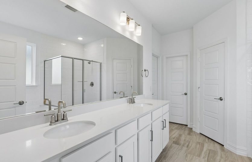 Private primary bath with two vanities