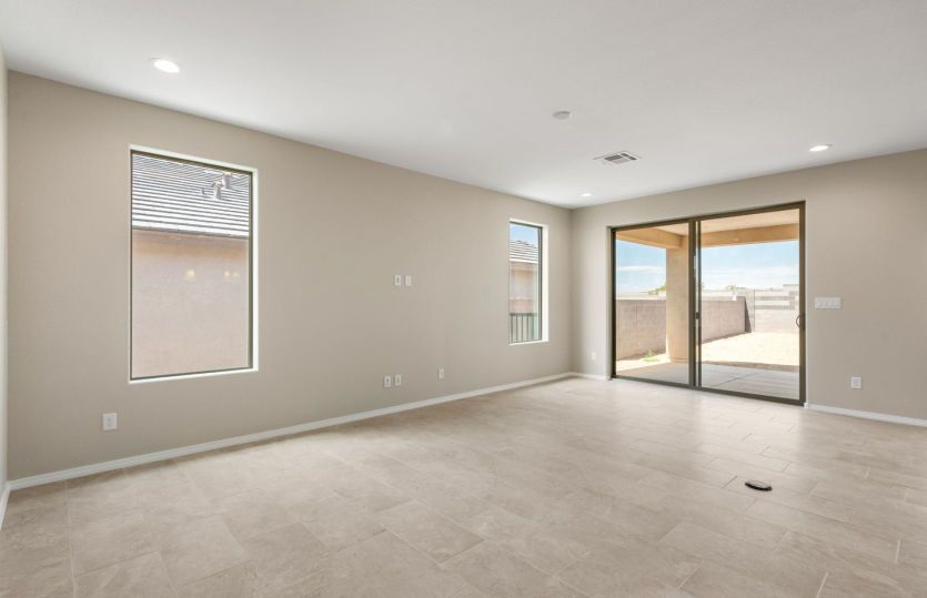Bright living area with sliding glass doors leading to the covered patio