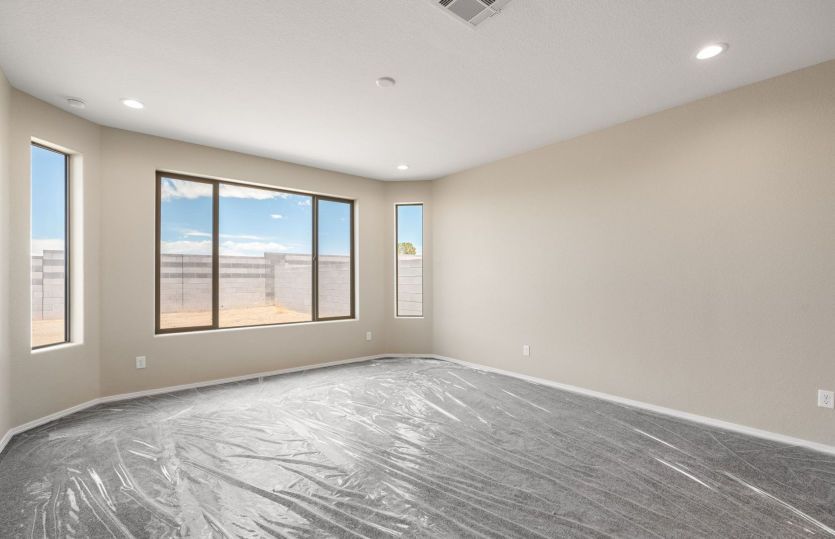 Spacious owner's suite featuring bay window for natural light and backyard views