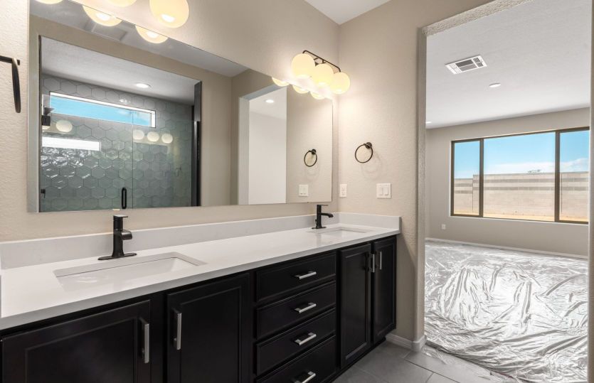 Elegant dual-sink vanity with modern black fixtures