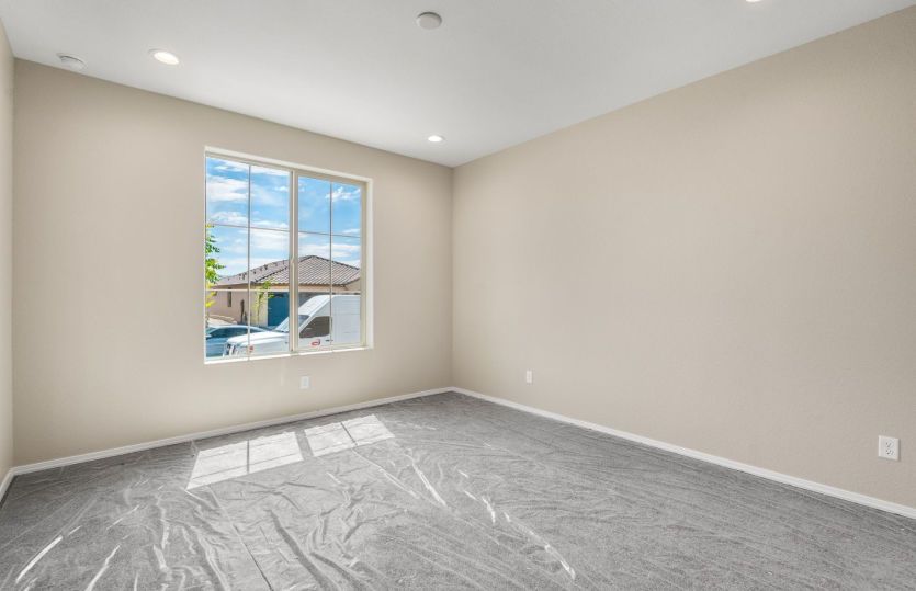 Versatile secondary bedroom filled with natural light