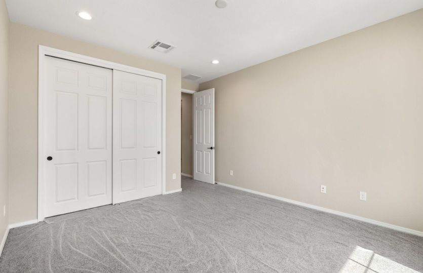 Comfortable secondary bedroom with generous closet space