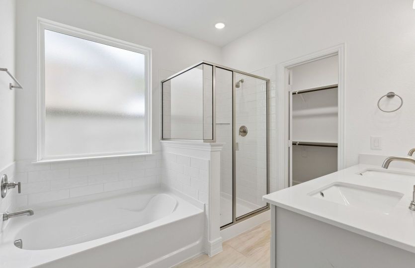Owners bath with separate tub and shower