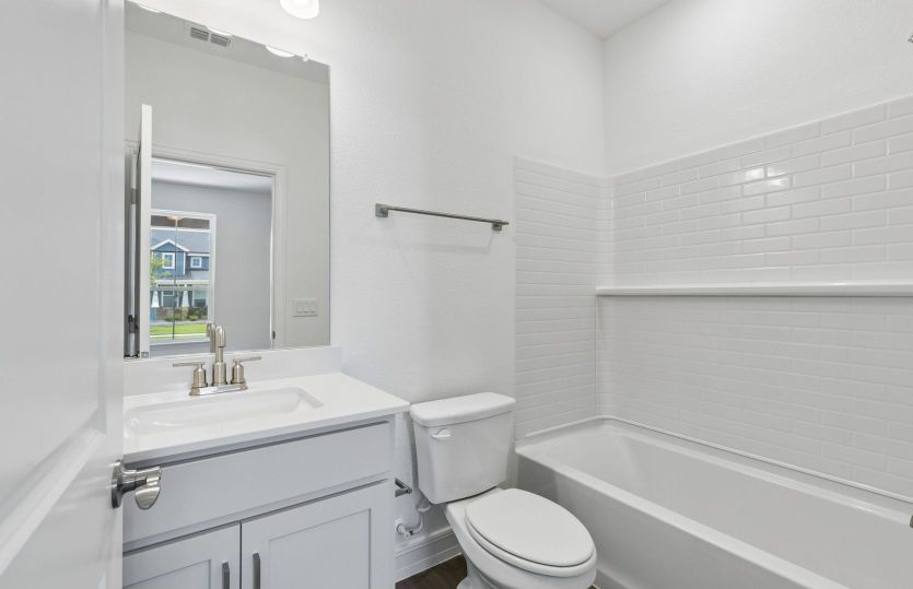 Secondary bath with tile surrounded shower