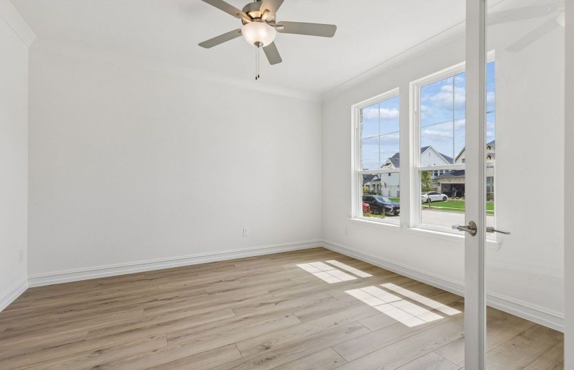 Office off home entry with large windows