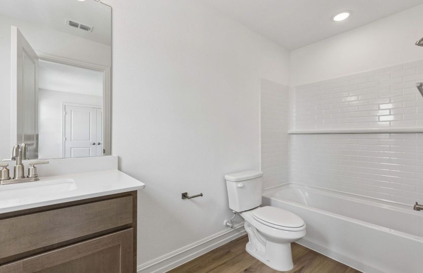 Secondary bath with tile surrounded shower